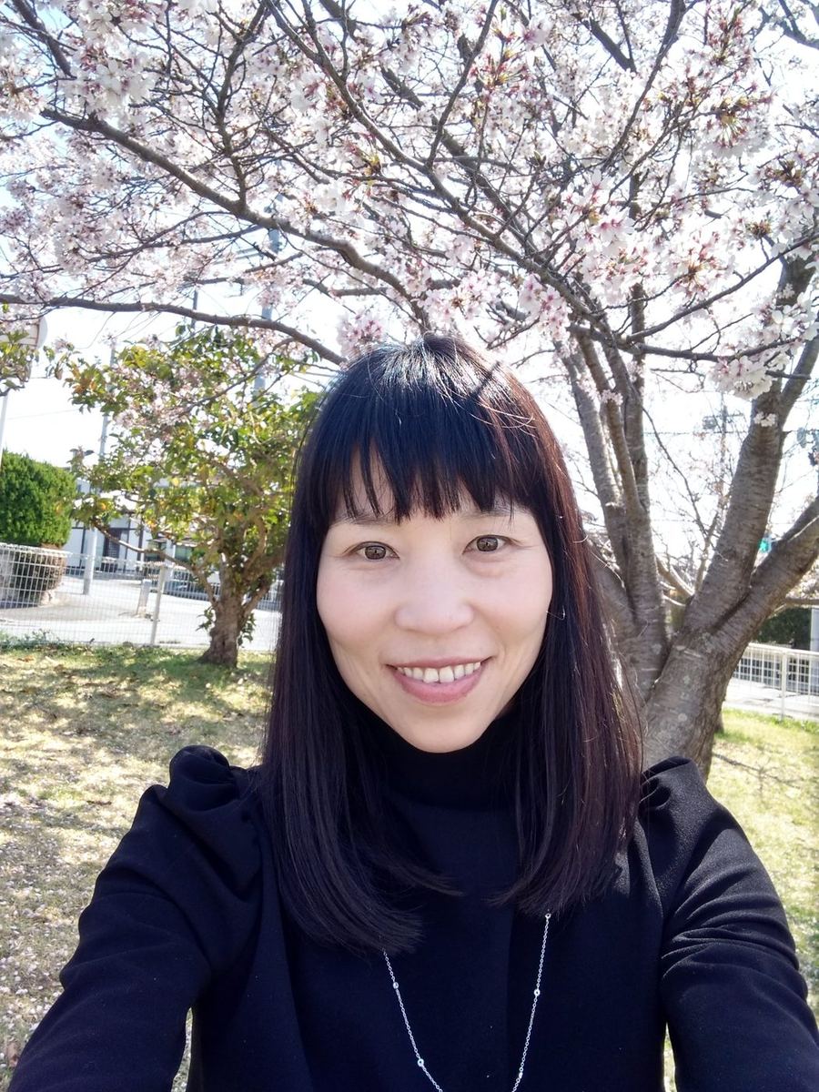 Tomoyo Seo, founder of FindaJapan, under cherry blossoms